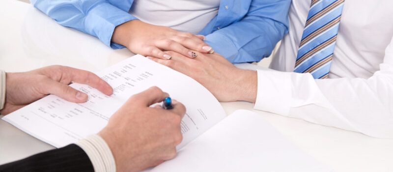 Financial Advisor is explaining a contract - young couple